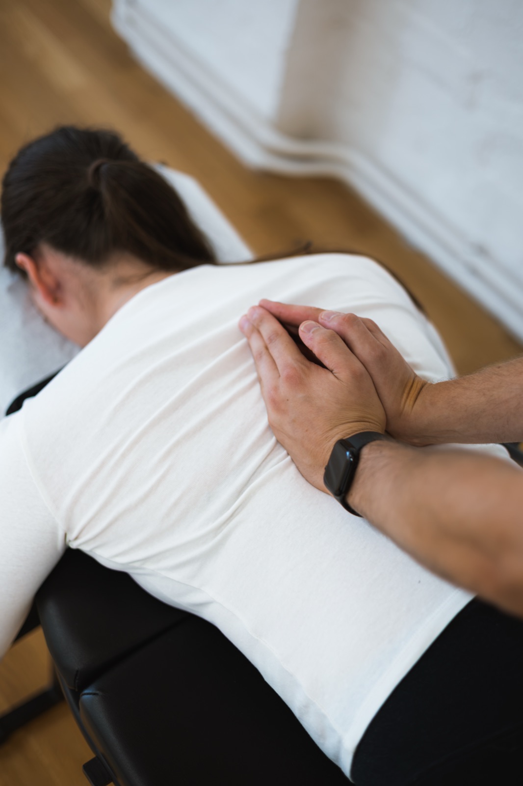 Tom adjusting a patient's lower back