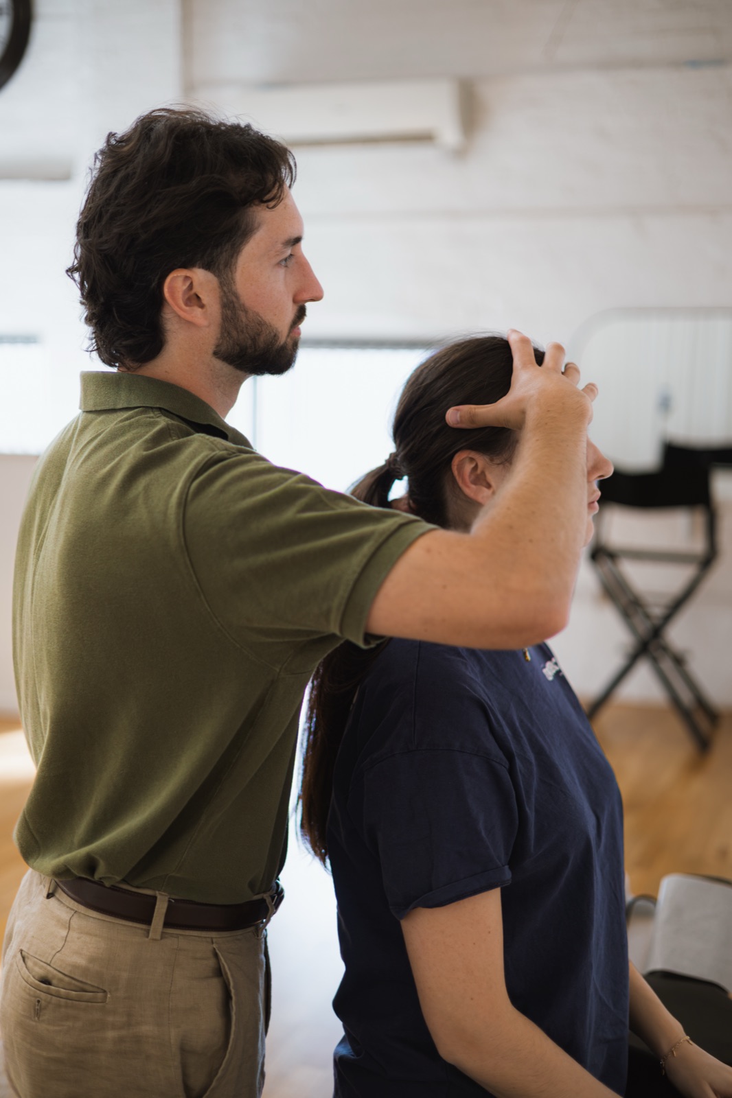 Tom adjusting a patient's neck