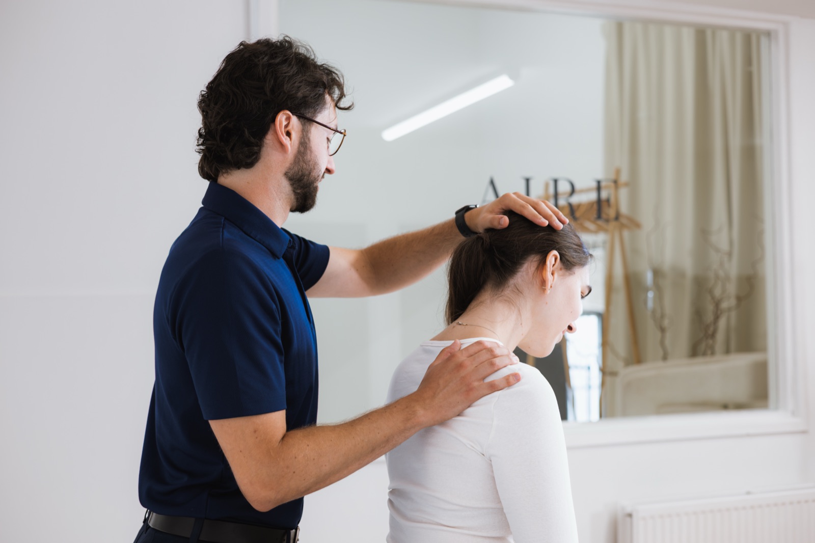 Tom checking how far a patient can turn their head